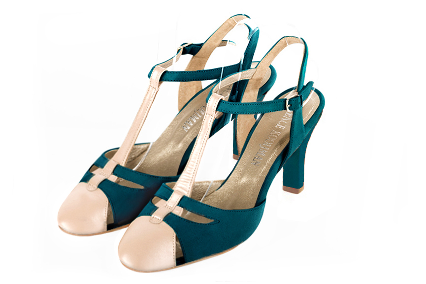 French elegance and refinement for these gold and peacock blue dress open back T-strap shoes, 
                available in many subtle leather and colour combinations. Its comfortable fit will accompany you until the end of the night.
Its charming, playful cutout gives you plenty of customization options.  
                Matching clutches for parties, ceremonies and weddings.   
                You can customize these shoes to perfectly match your tastes or needs, and have a unique model.  
                Choice of leathers, colours, knots and heels. 
                Wide range of materials and shades carefully chosen.  
                Rich collection of flat, low, mid and high heels.  
                Small and large shoe sizes - Florence KOOIJMAN